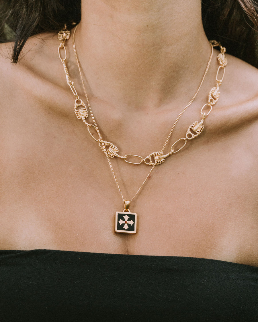 MIDNIGHT OYNX CROSS PENDANT IN GOLD