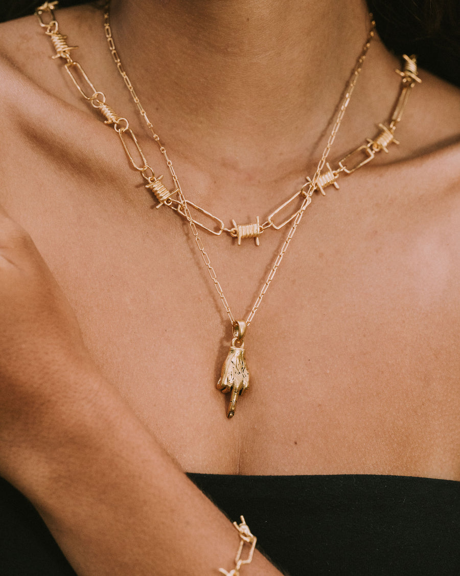 MIDDLE FINGER PENDANT IN GOLD