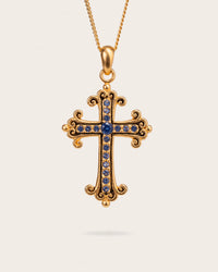 SAPPHIRE CROSS PENDANT IN GOLD