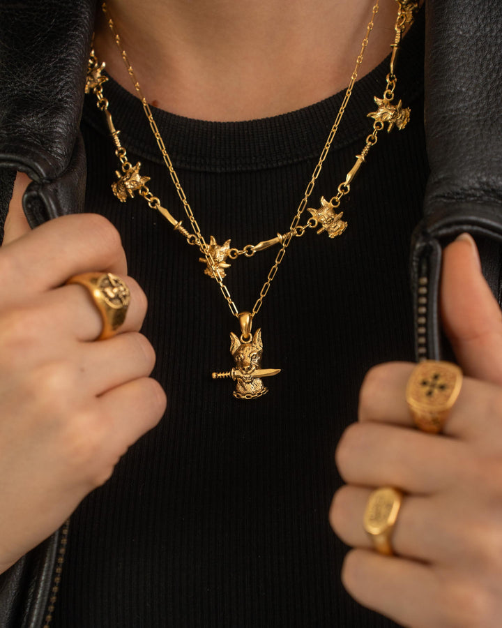 DOG AND DAGGER PENDANT IN GOLD