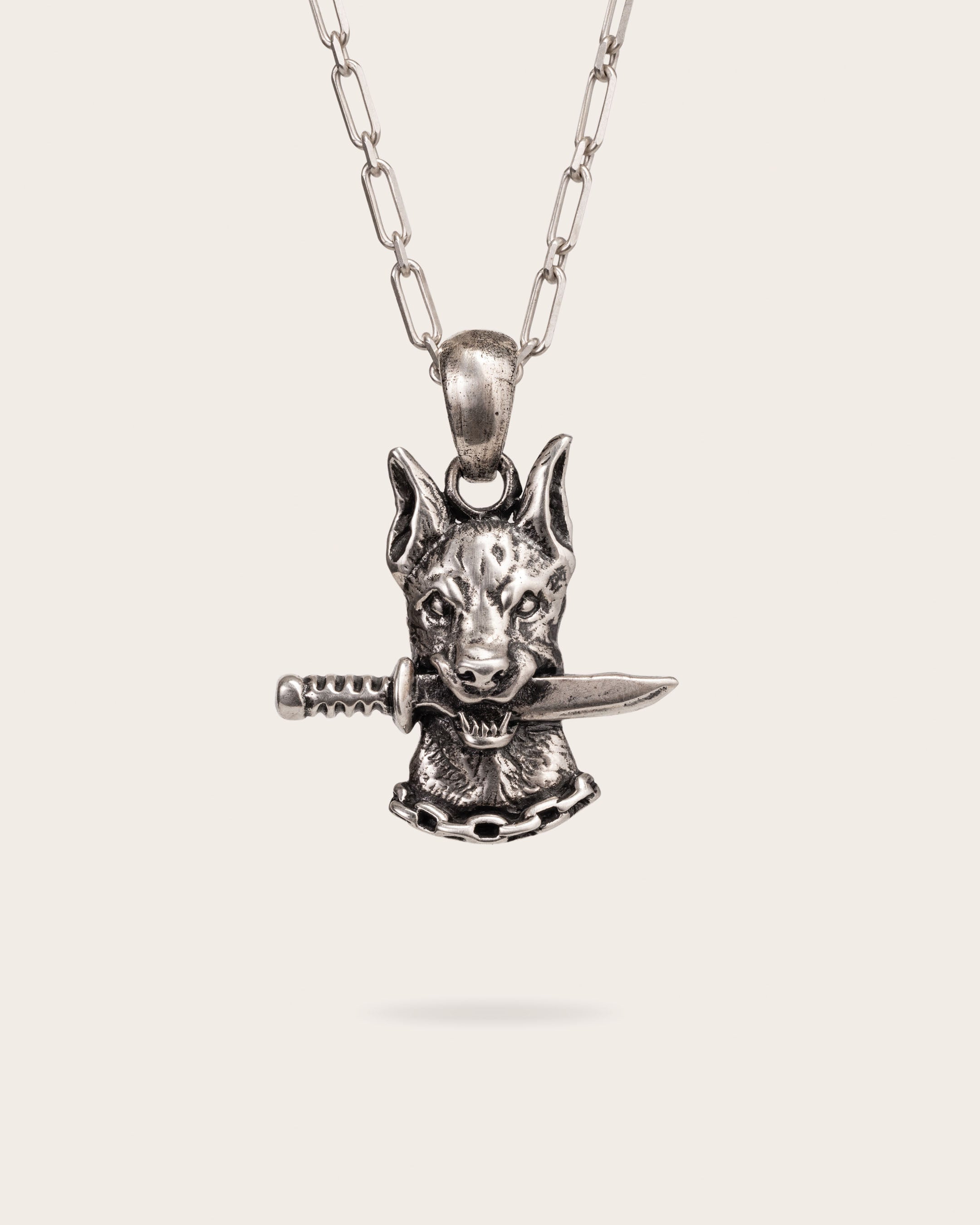 DOG AND DAGGER PENDANT IN SILVER