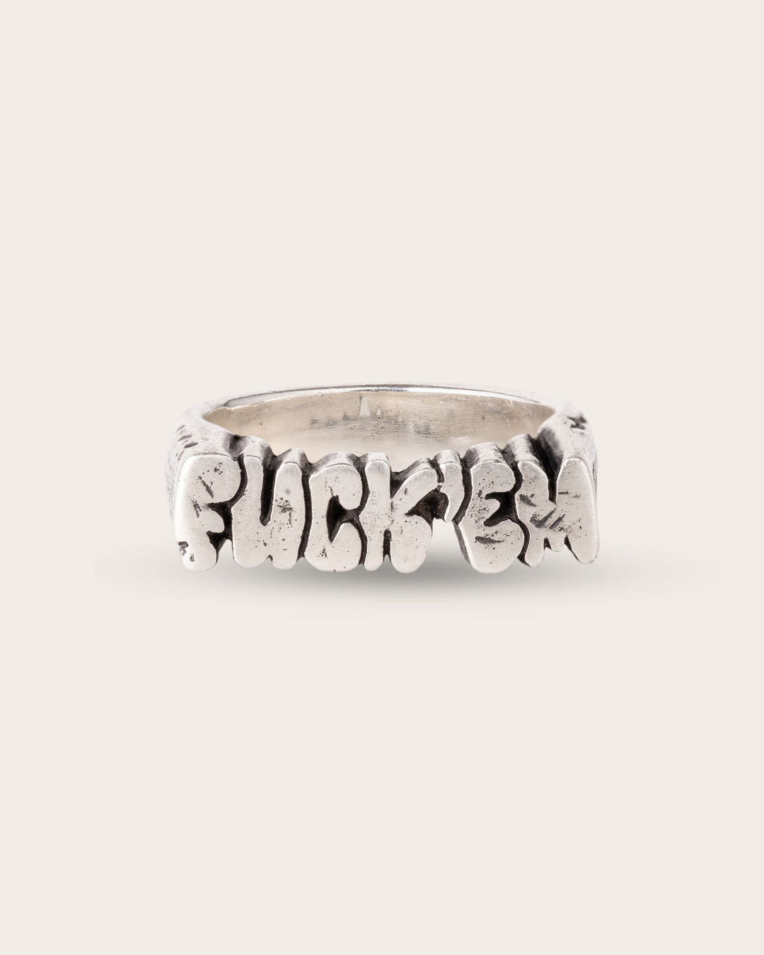 FUCK ‘EM RING IN SILVER