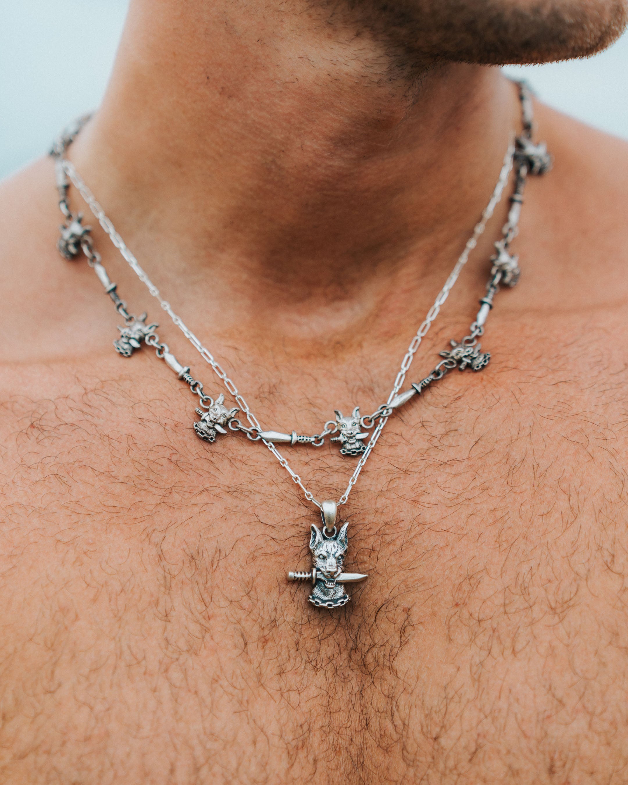 DOG AND DAGGER PENDANT IN SILVER