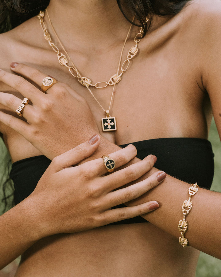 MIDNIGHT OYNX CROSS RING IN GOLD