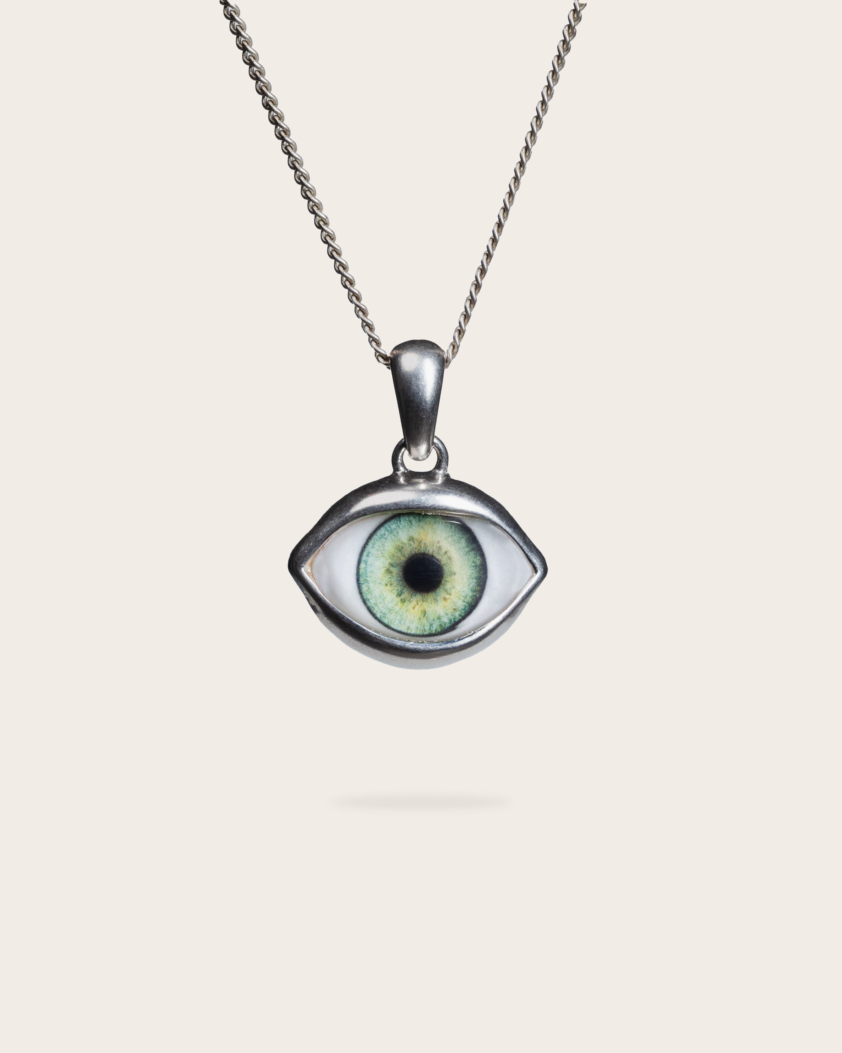 GREEN EYE PENDANT IN SILVER