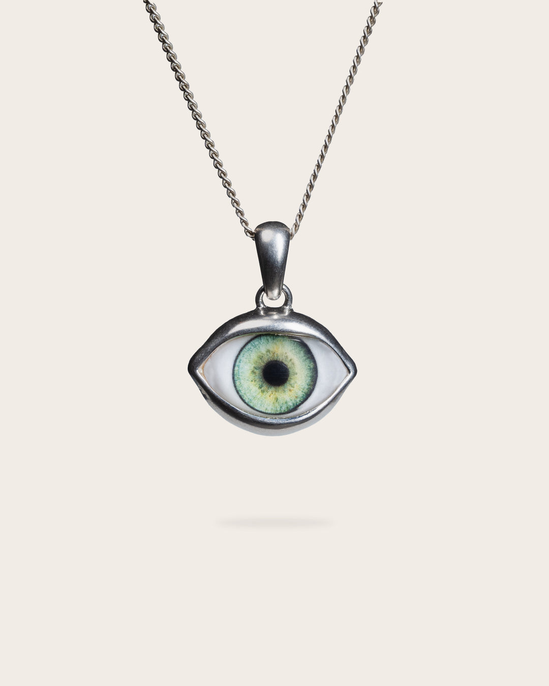 GREEN EYE PENDANT IN SILVER