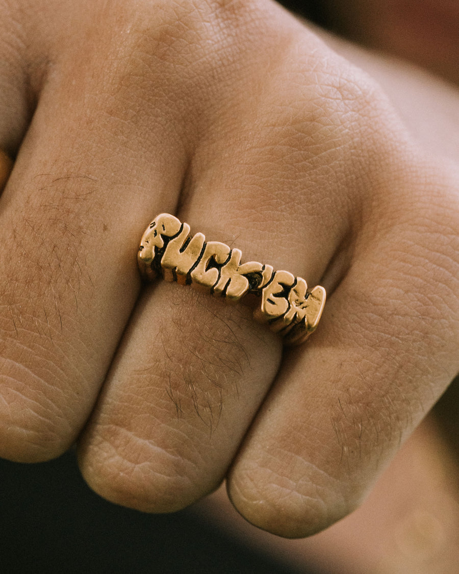 FUCK ‘EM RING IN GOLD