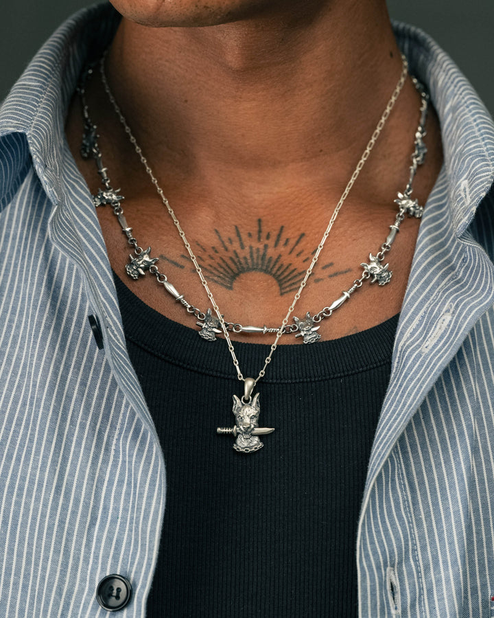 dog and dagger pendant in silver and dog & dagger neckchain in silver model photograph