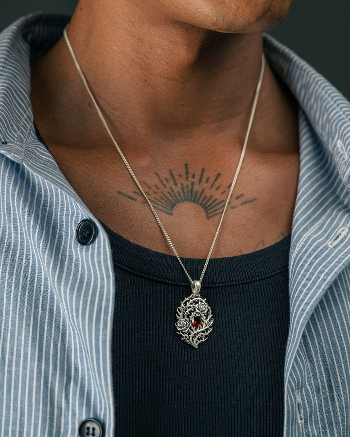 blood rose thorn pendant in silver model photograph