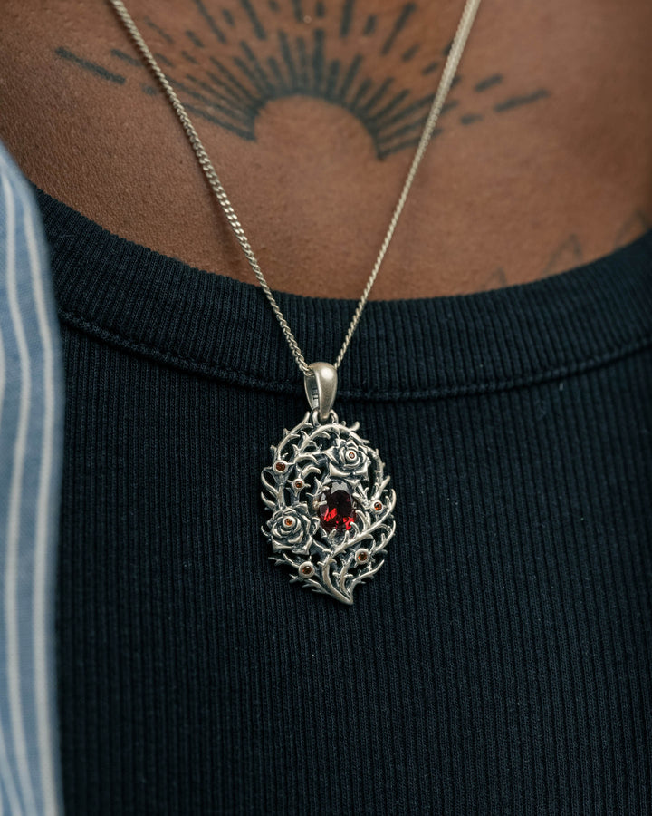 blood rose thorn pendant in silver model photograph