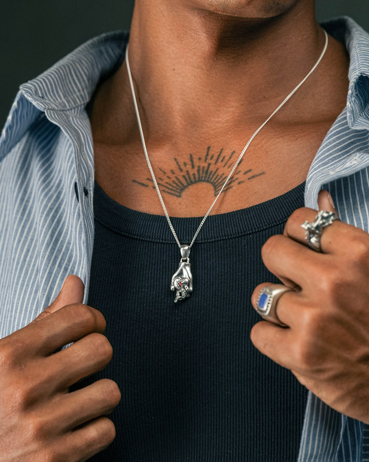 hand heart stone pendant in silver and blue & red leopard gemstone ring in silver and tiger guardian ring in silver model photograph
