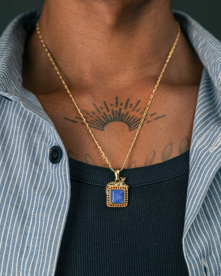 blue & red leopard gemstone pendant in gold model photograph