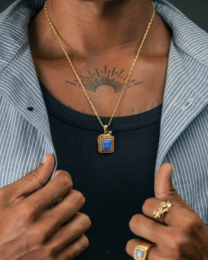 blue & red leopard gemstone pendant in gold and blue & red leopard gemstone ring in gold and tiger guardian ring in gold model photograph