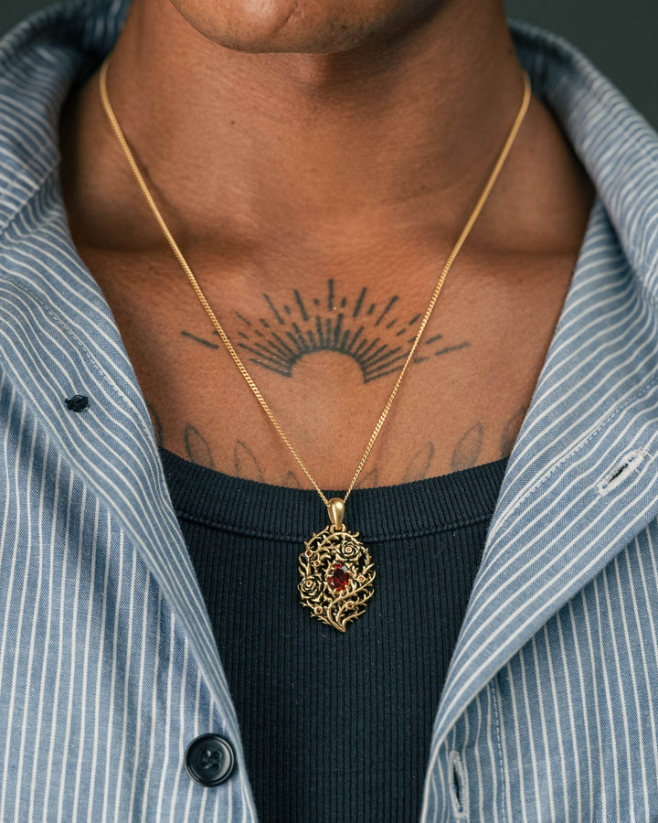 blood rose thorn pendant in gold model photograph