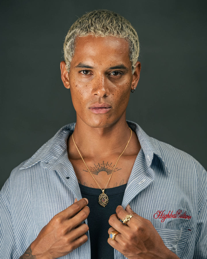 blood rose thorn pendant in gold and blue & red leopard gemstone ring in gold and tiger guardian ring in gold model photograph