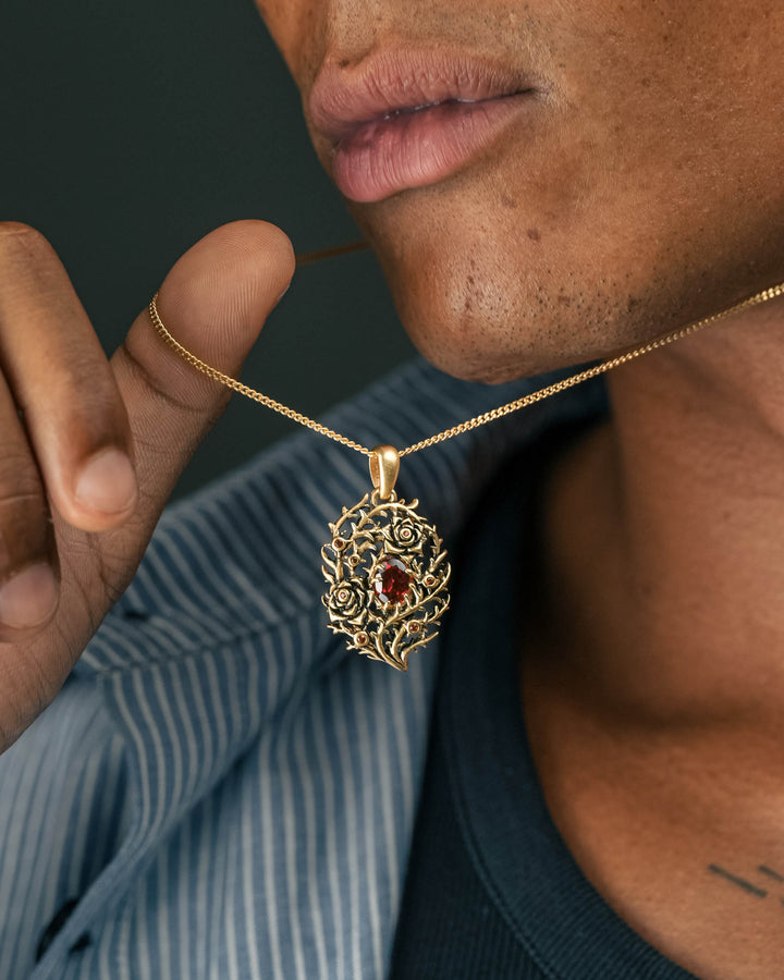 blood rose thorn pendant in gold model photograph