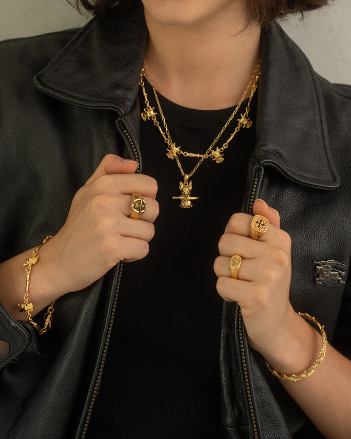 DOG AND DAGGER PENDANT IN GOLD