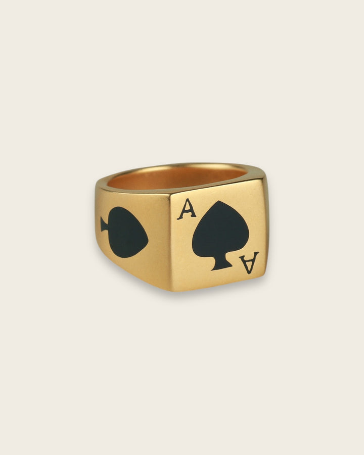 CARD RING WITH BLACK STONE IN GOLD