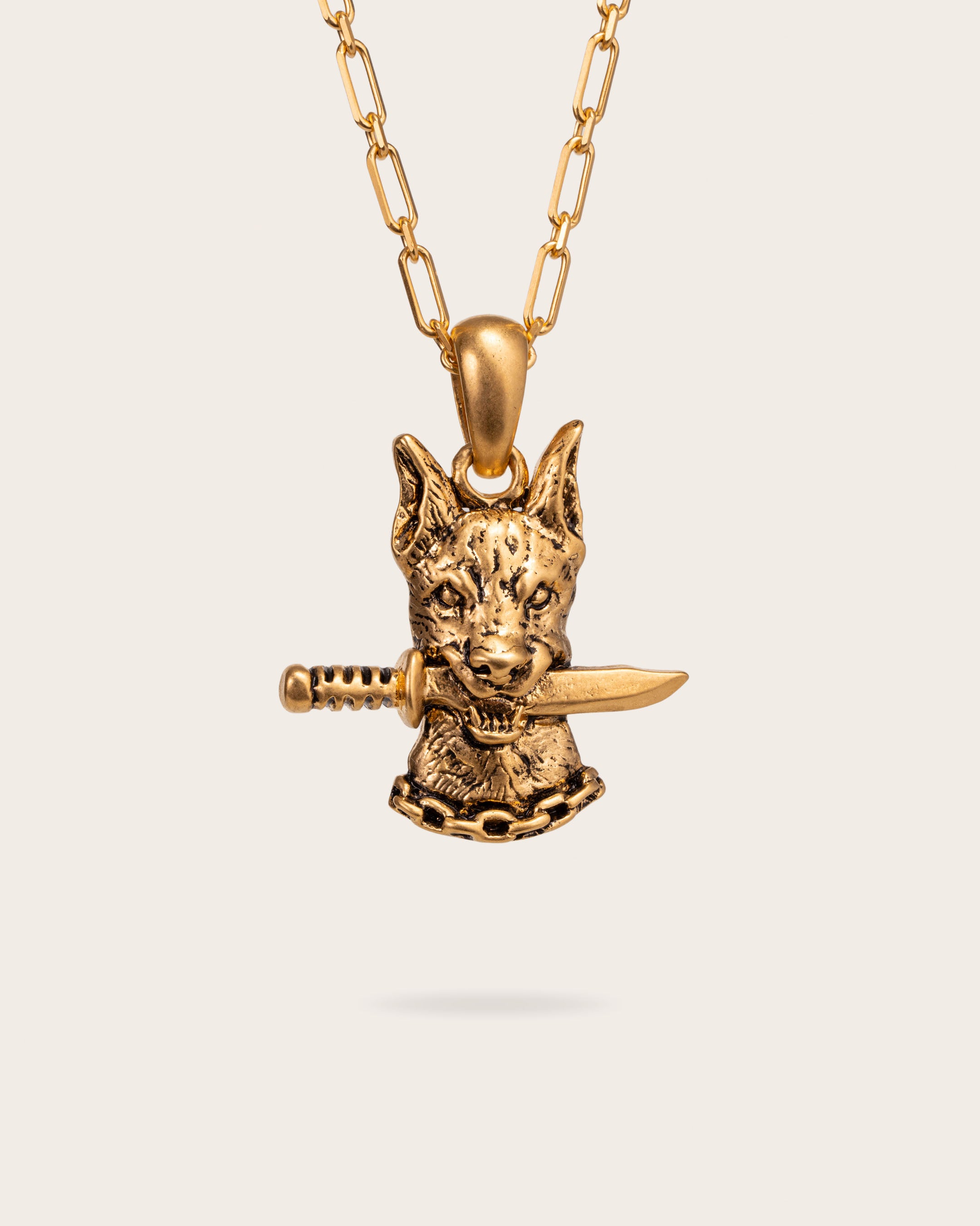 DOG AND DAGGER PENDANT IN GOLD