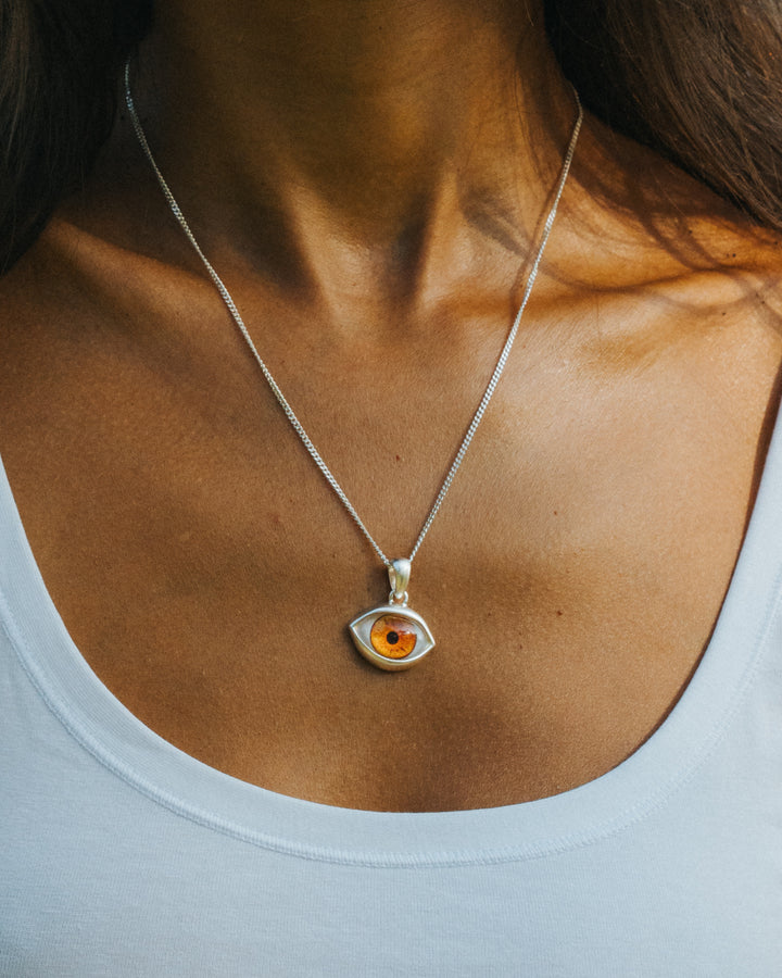 BROWN EYE PENDANT IN SILVER