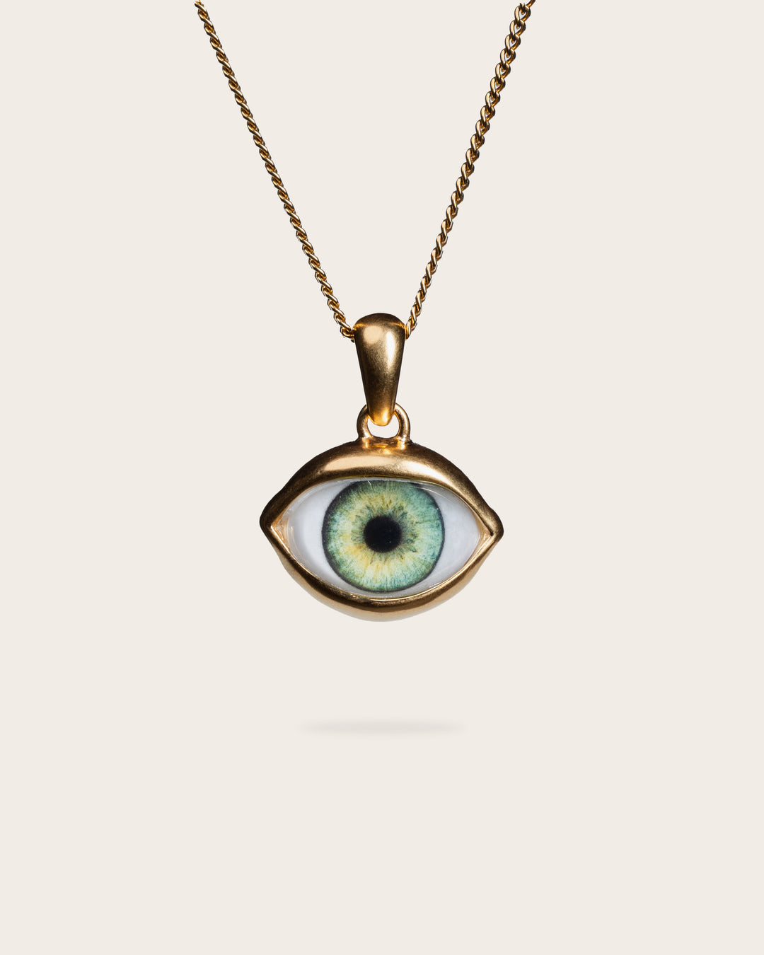 GREEN EYE PENDANT IN GOLD
