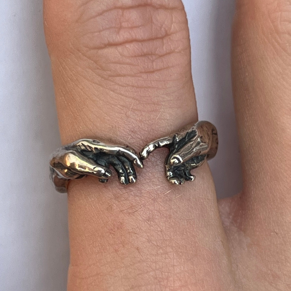 HAND OF GOD RING IN SILVER