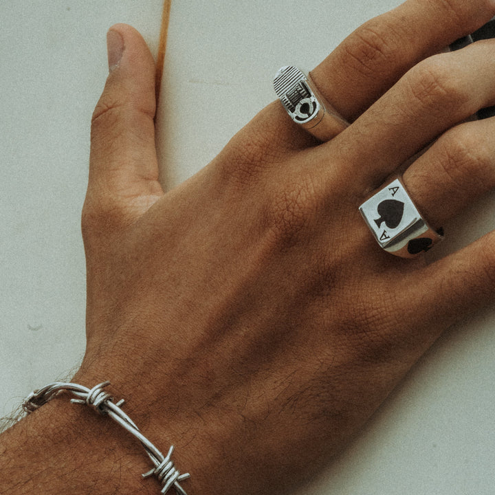 CARD RING WITH BLACK STONE IN SILVER